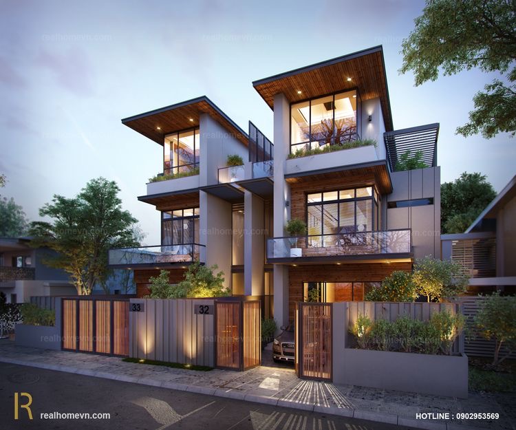 A stylish and modern living room interior in Pune, featuring natural light and biophilic elements.